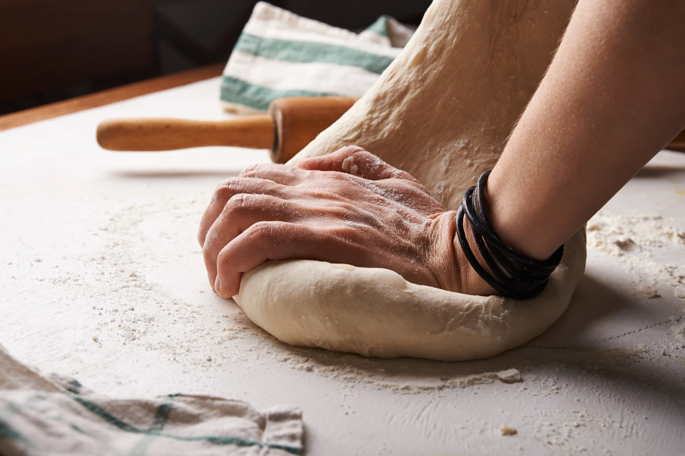Baker kneading dough