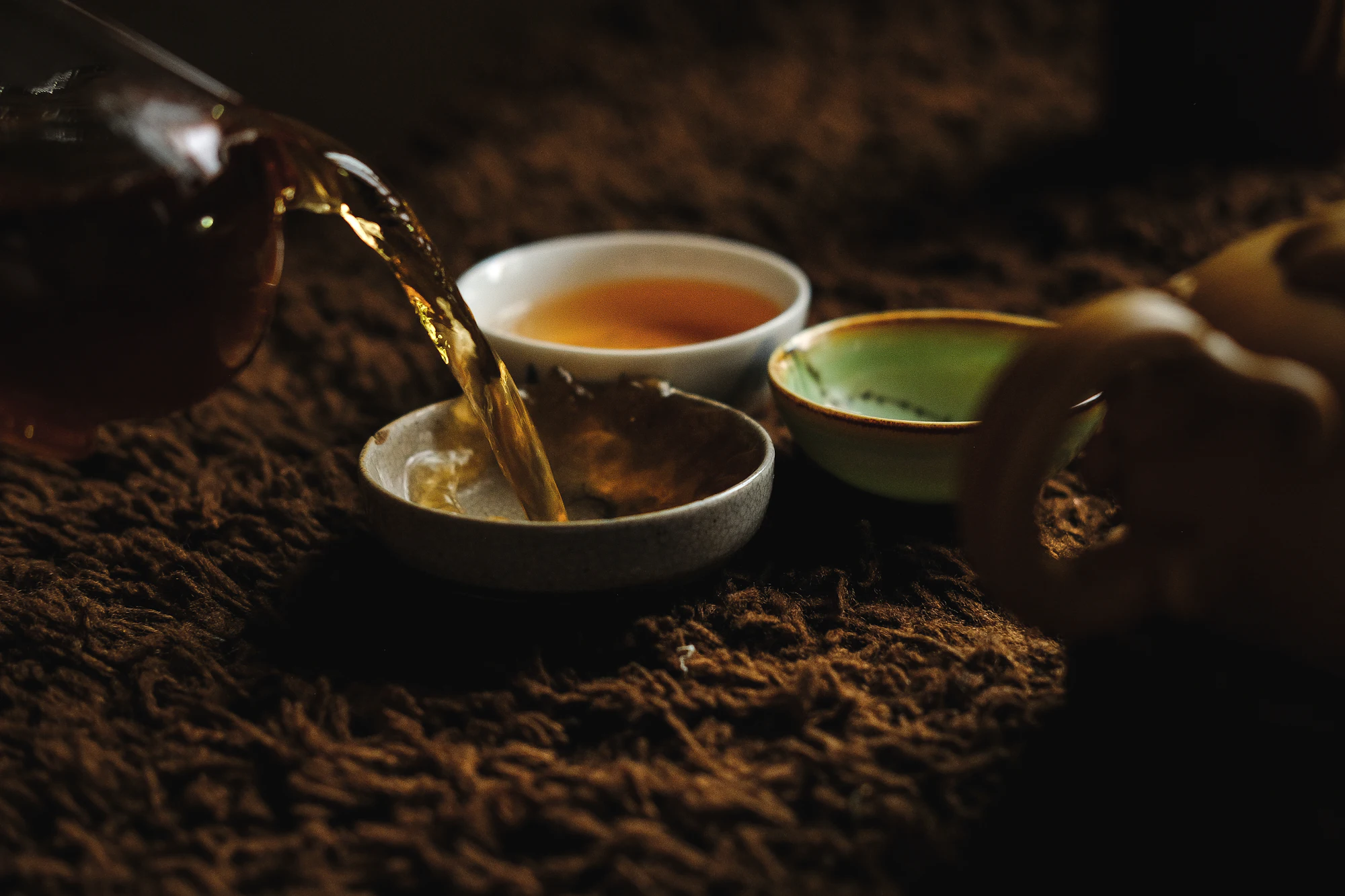 Pouring tea into cups