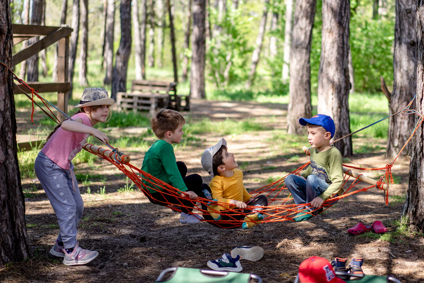 Kids in a hammock in the woods