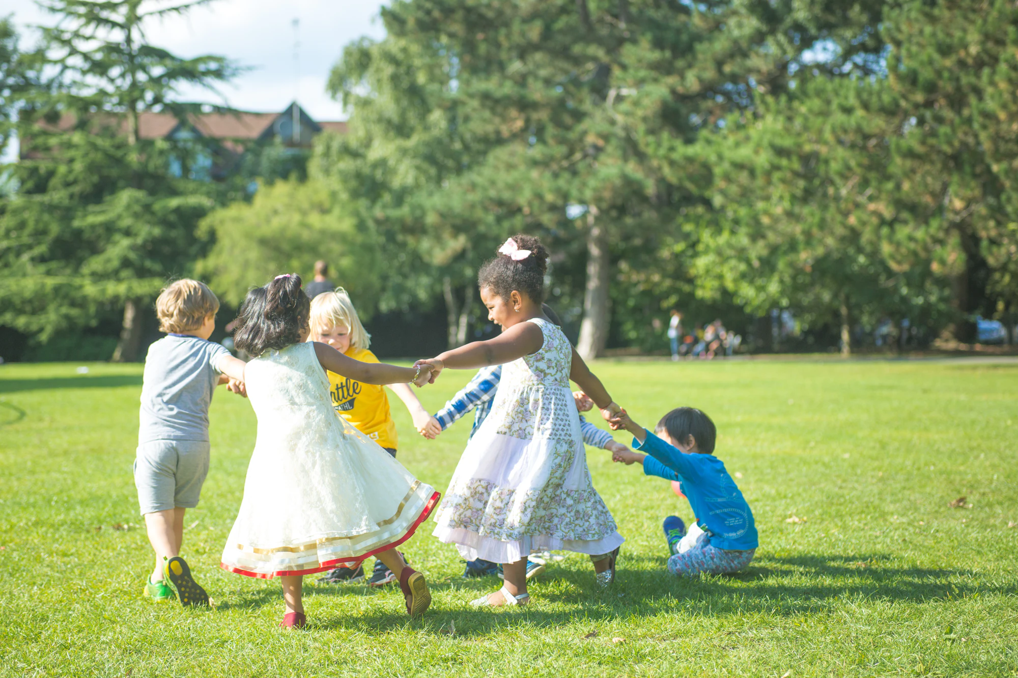 Children playing in a circle outside