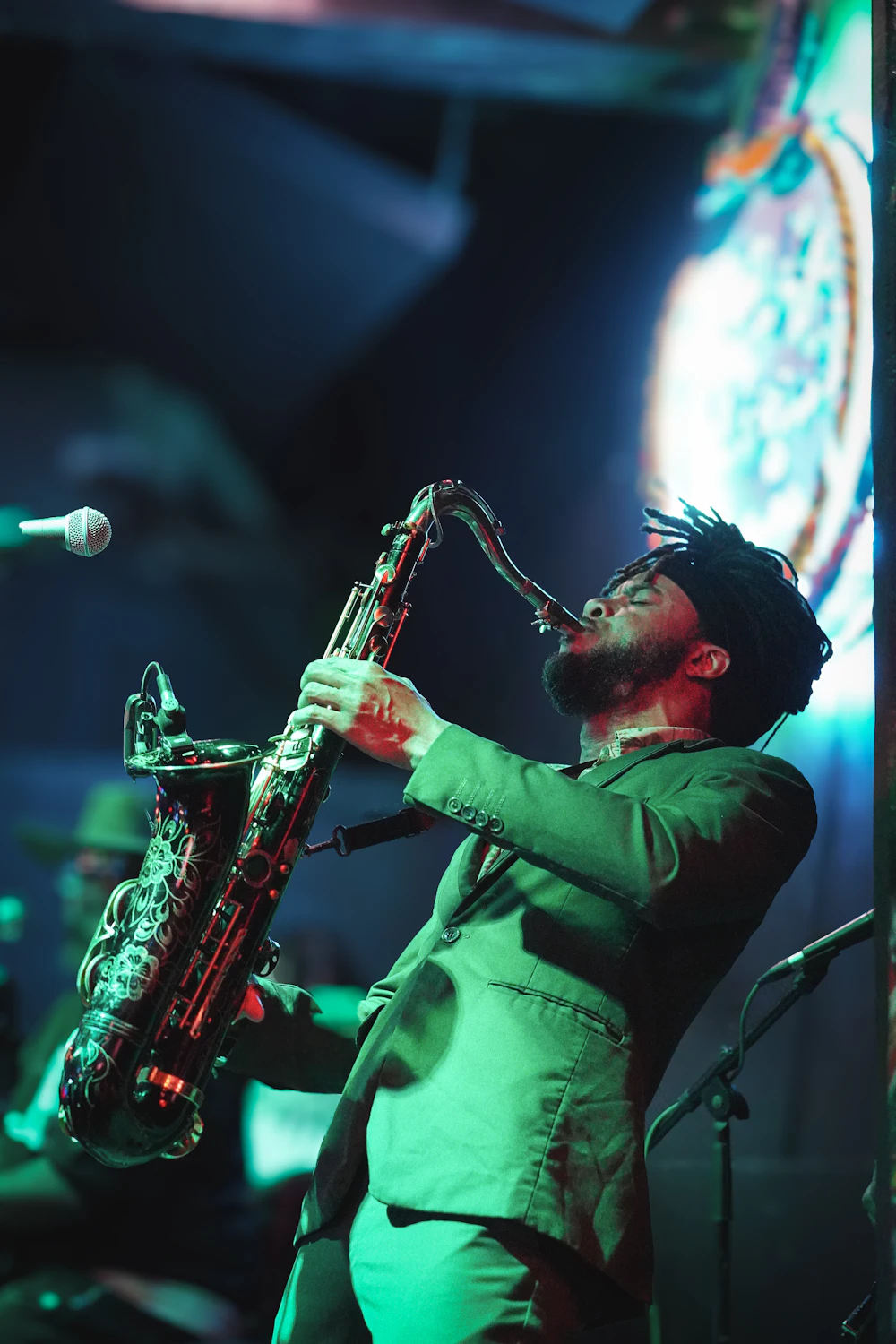 Saxophonist in green suit