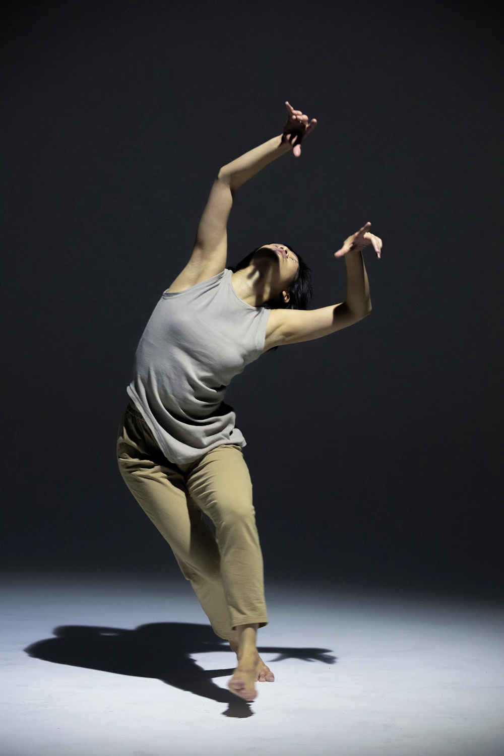 Dancer reaching back