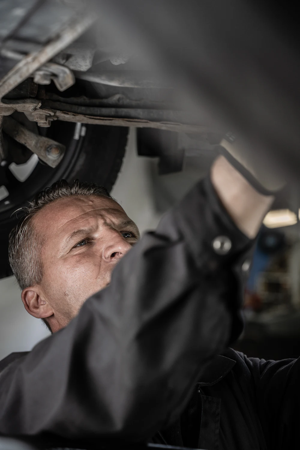 Mechanic under a vehicle